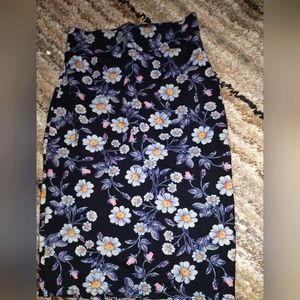 Skirt,small in size,brand new it's black with decorative flowers